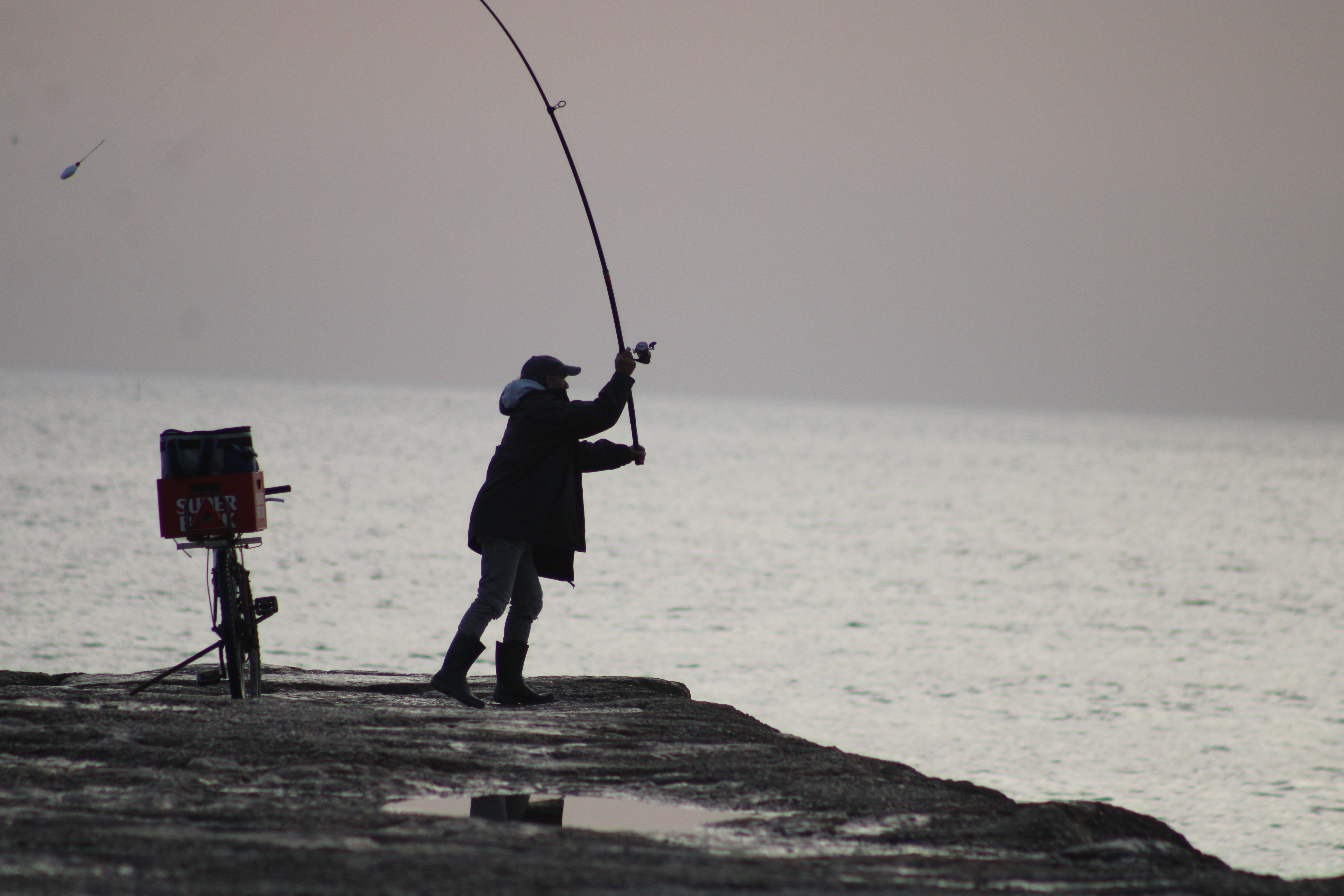 Fisherman casting colour